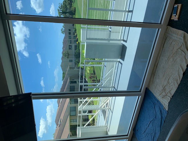 Large residential window film installation overlooking an outdoor terrace