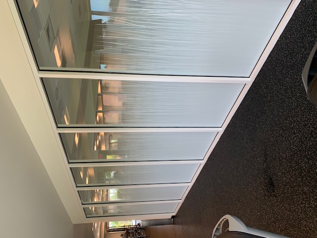 Decorative privacy film on an office glass wall